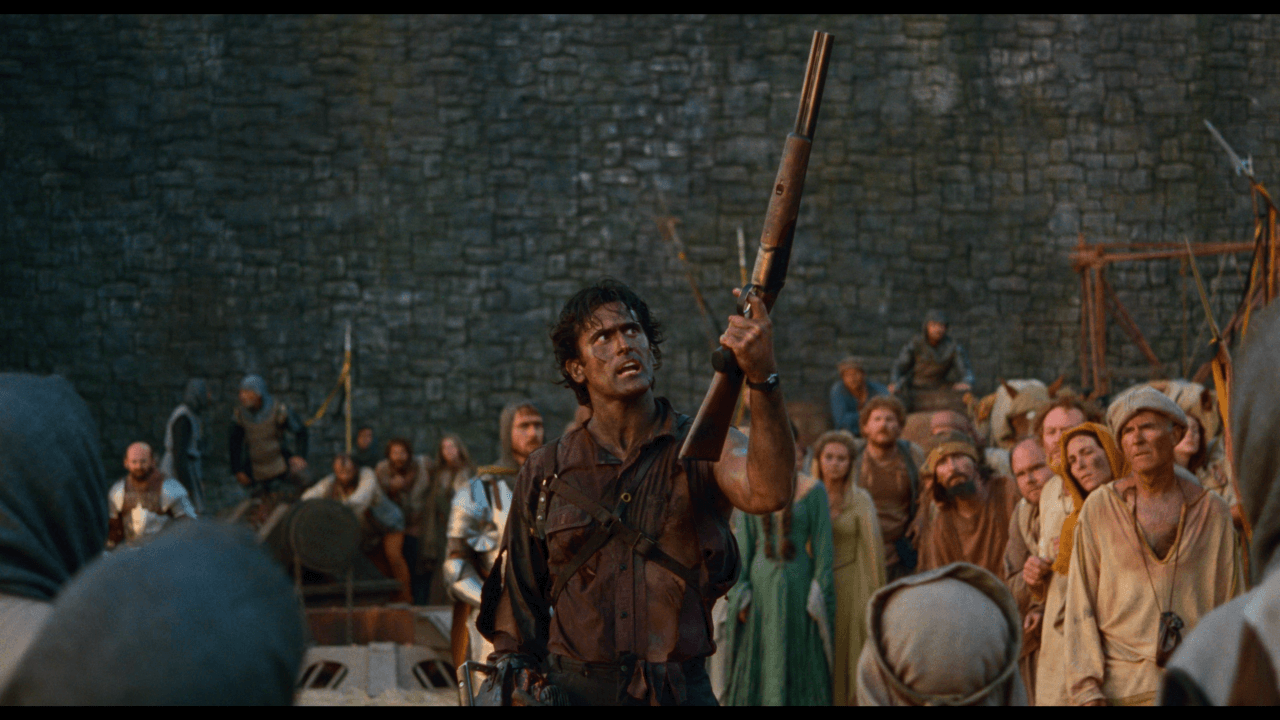 Army of Darkness - Ash Williams presents his boomstick to a crowd of medieval peasants